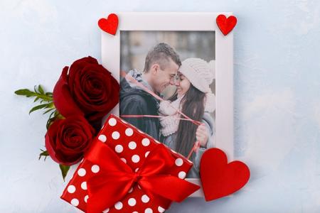 Beautiful love photo frame with rose flowers and gift box